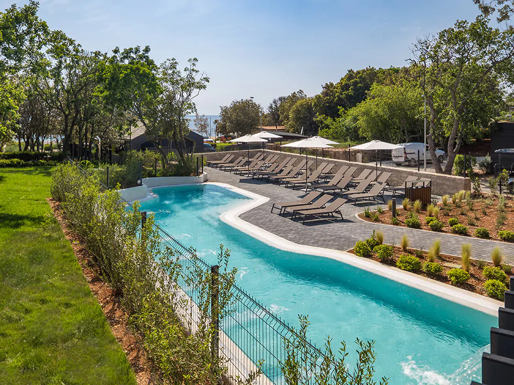 campsite-mon-perin-exterior-pools-sunbeds-horticulture-sea-view