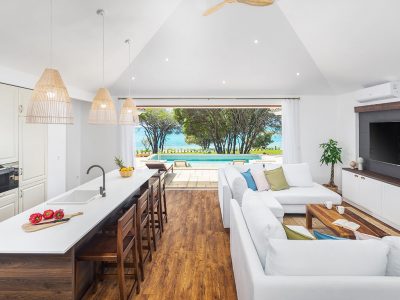 camping-mon-perin-beach-front-villa-porto-bus-interior-kitchen-living-room-sea-pool-view