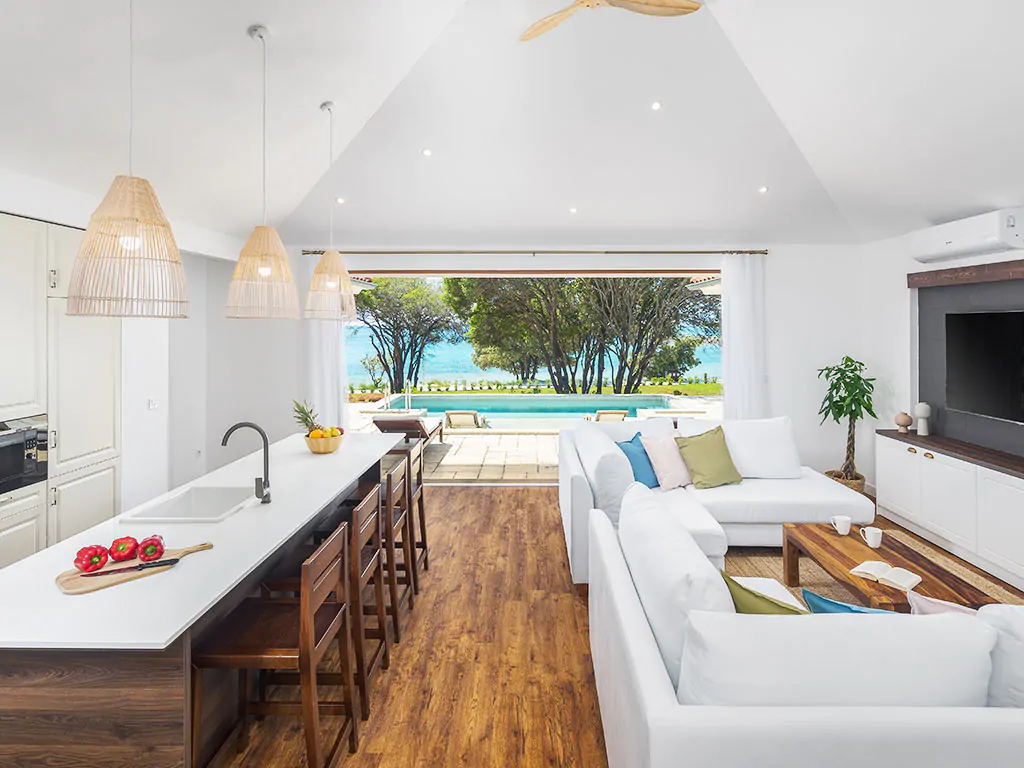 camping-mon-perin-beach-front-villa-porto-bus-interior-kitchen-living-room-sea-pool-view