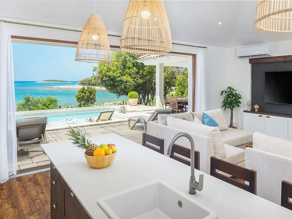 camping-mon-perin-beach-front-villa-porto-bus-interior-kitchen-sea-pool-view