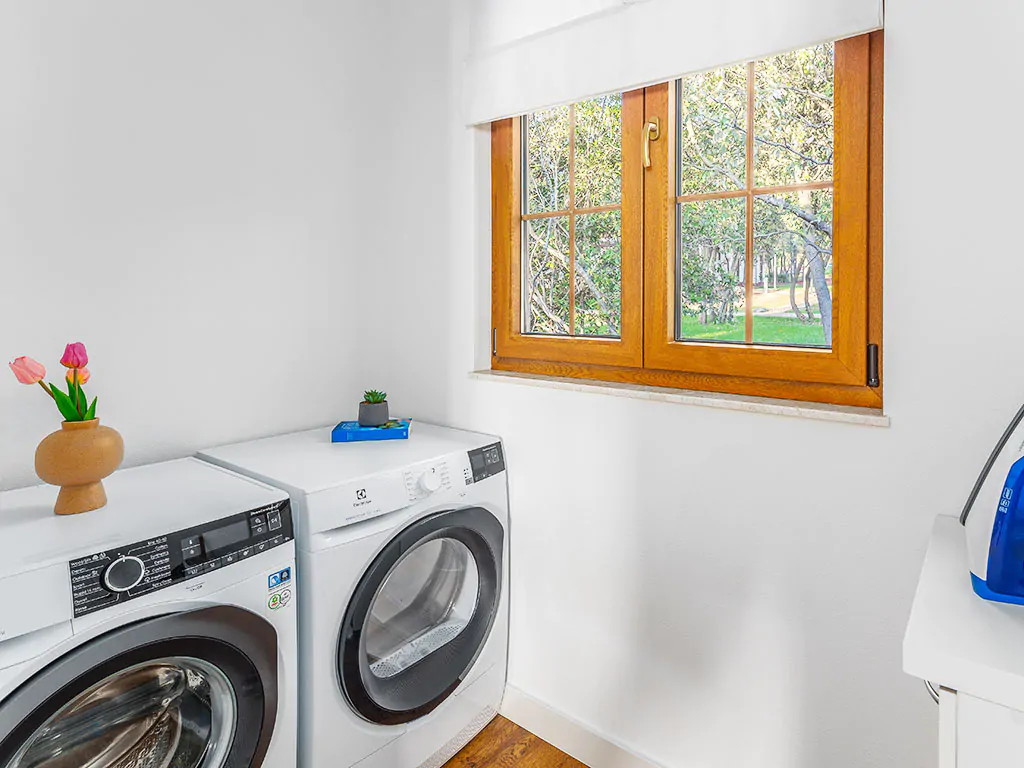 camping-mon-perin-beach-front-villa-porto-bus-interior-laundry-dryer-machine-laundry-room-2
