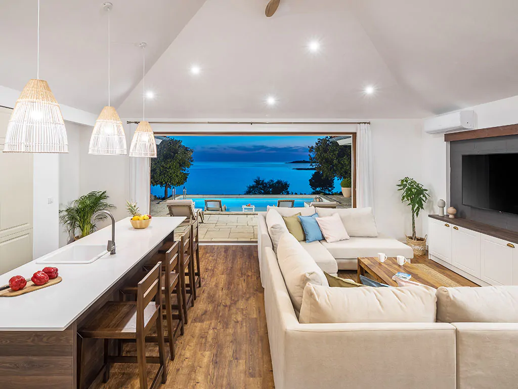 camping-mon-perin-beach-front-villa-porto-bus-interior-living-room-night-sea-view