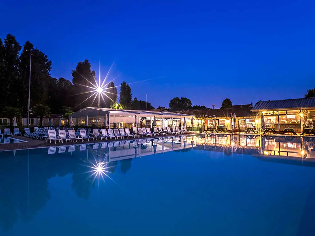 venezia-camping-in-town-restaurant-and-pool-area-at-night