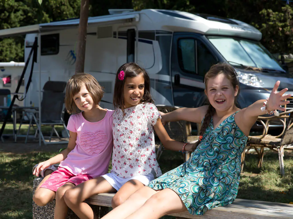 campsite-adria-ankaran-camper-pitch-family-time-kids-playing-2