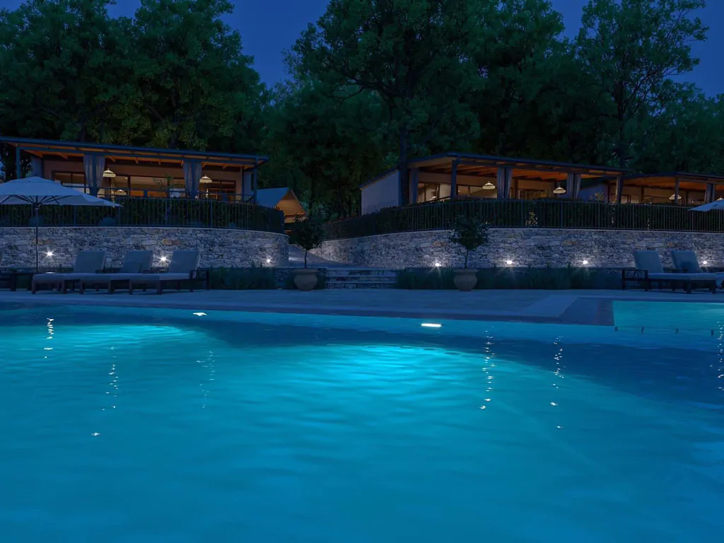 campsite-banki-istiran-village-mobile-homes-exterior-pool-by-night