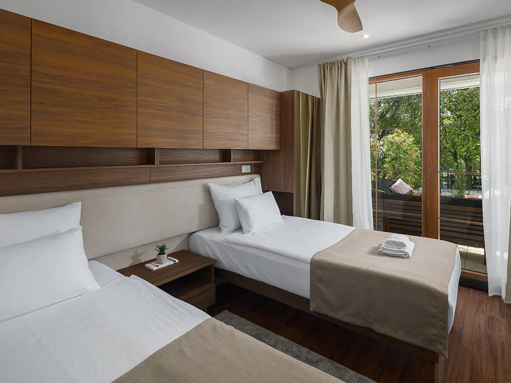 campsite-mon-perin-luxury-bay-villa-porto-bus-jacuzzi-interior-bedroom-single-beds