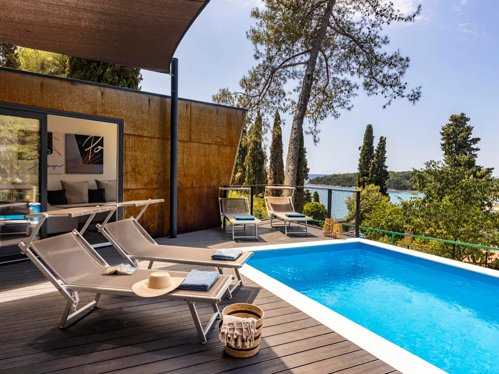 campsite-porton-nature-hideout-holiday-home-pool-1-module-exterior-terrace-pool-sunset-sea-view