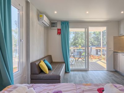 campsite-santa-marina-mobile-home-romantic-suite-interior-kitchen-living-room-couch