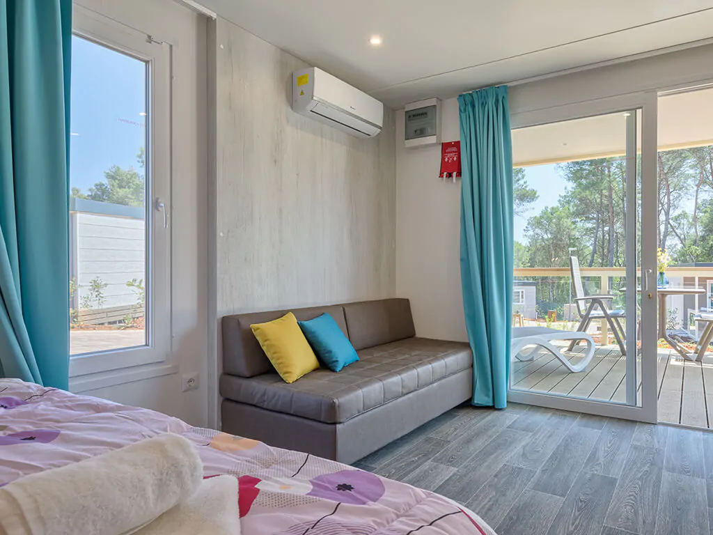 campsite-santa-marina-mobile-home-romantic-suite-interior-living-room-terrace