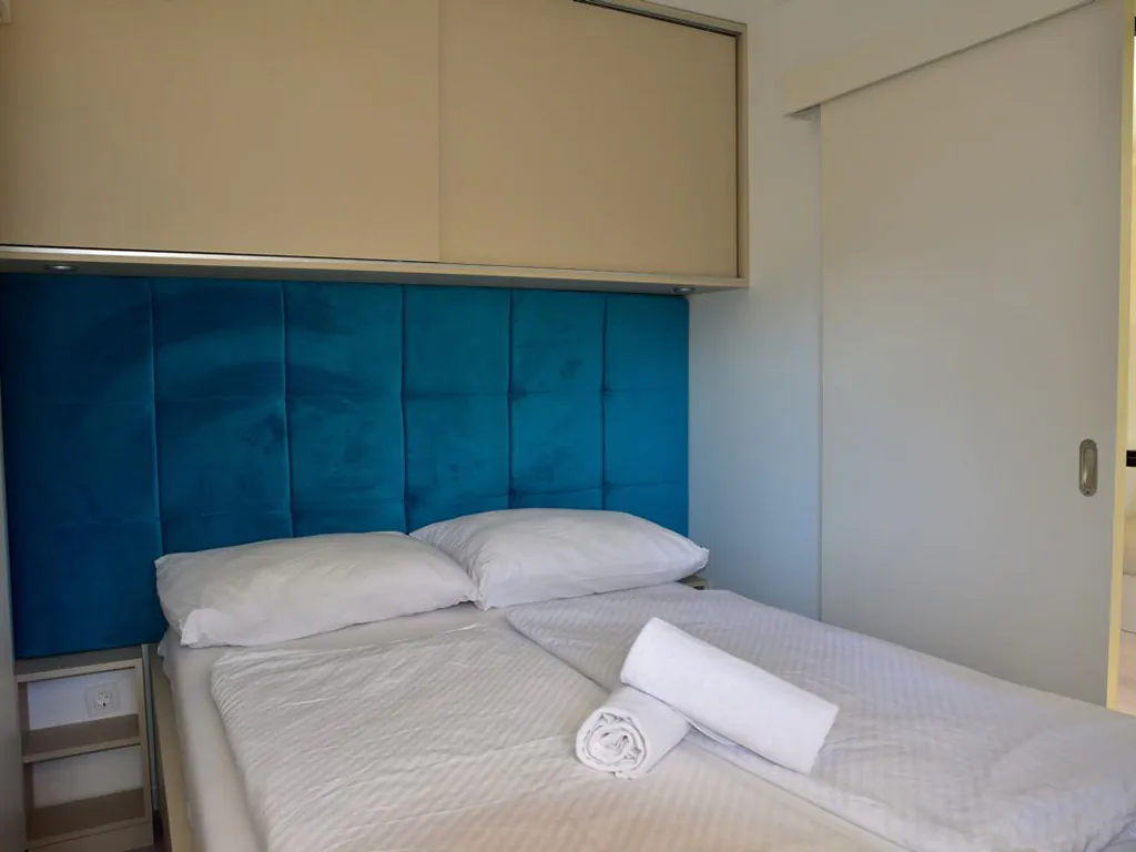 camping-glavotok-premium-bungalow-interior-bedroom-double-bed