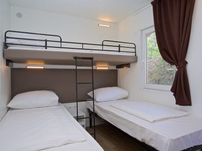 campsite-cikat-mobile-home-type-c-interior-bedroom-single-beds-2