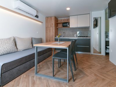 camping-morenia-beach-resort-mobile-home-interior-living-room-sofa-2