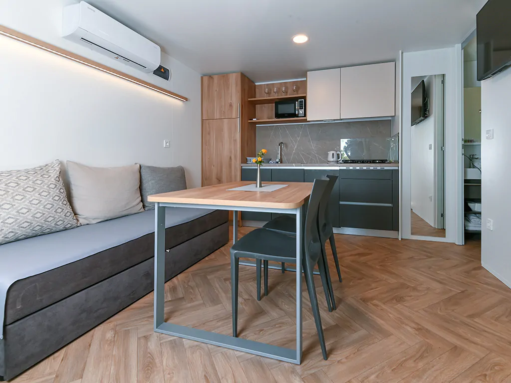 camping-morenia-beach-resort-mobile-home-interior-living-room-sofa-2