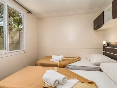 camping-porat-mobile-home-gold-interior-single-beds-2
