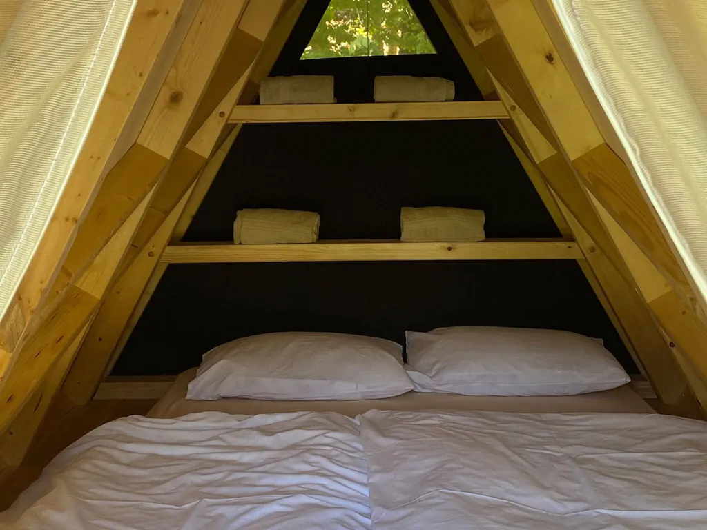 falkensteiner-premium-camping-lake-blagus-exterior-lake-house-with-wooden-tent
