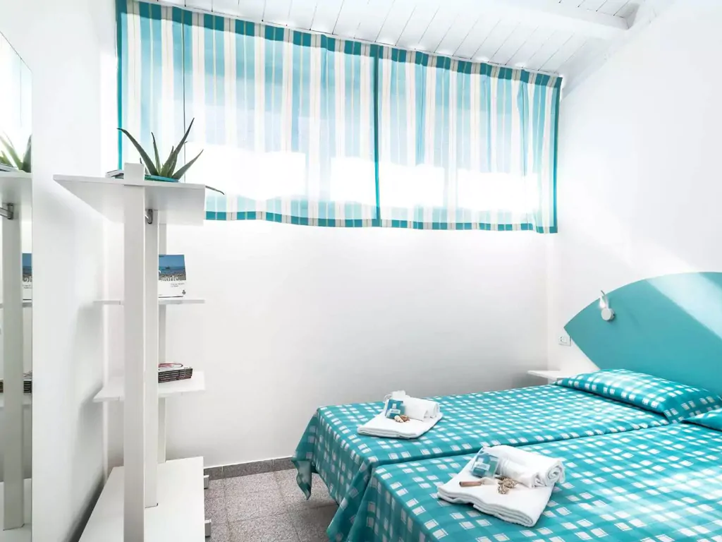apartment-mini-villaggio-san-francesco-interior-double-bed