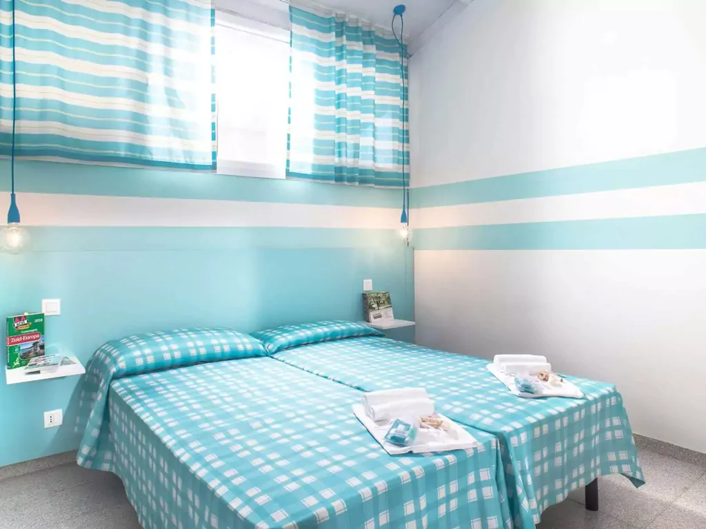 apartment-mini-villaggio-san-francesco-interior-single-beds-ii