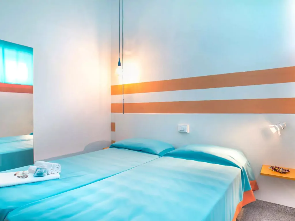 apartment-mini-villaggio-san-francesco-interior-single-beds