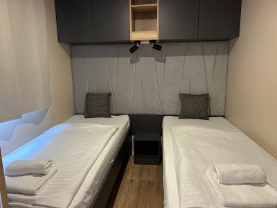 elements-camping-selce-deluxe-olive-interior-bedroom-single-beds