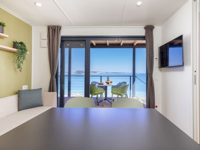 camping-arena-stupice-mobile-home-camping-home-first-row-to-the-sea-interior-dining-area-view-2