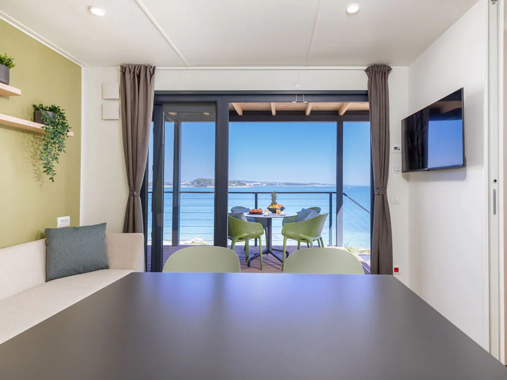 camping-arena-stupice-mobile-home-camping-home-first-row-to-the-sea-interior-dining-area-view-2