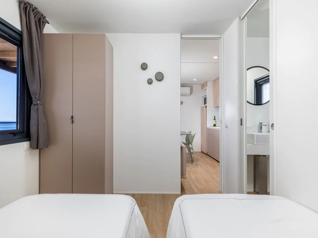 camping-arena-stupice-mobile-home-camping-home-sea-view-interior-bedroom-single-beds-2