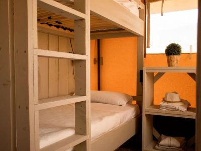 camping-village-cisano-san-vito-glamping-tent-estivo-safari-tent-compact-interior-bedroom-bunk-bed-view-2