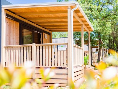 camping-naturist-solaris-casa-pini-mobile-home-couple-exterior-mobile-home-terrace-view