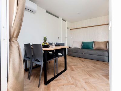 camping-naturist-solaris-casa-pini-mobile-home-luxury-interior-living-room-and-dining-area