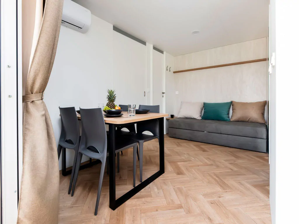 camping-naturist-solaris-casa-pini-mobile-home-luxury-interior-living-room-and-dining-area