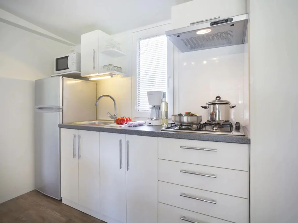 campsite-polari-mobile-home-standard-with-shared-pool-interior-kitchen