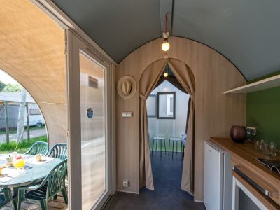 camping-village-punta-navaccia-glamping-tent-coco-tents-interior-kitchen-and-terrace-view