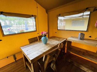 camping-village-punta-navaccia-glamping-tent-safari-lodge-tents-interior-dining-table