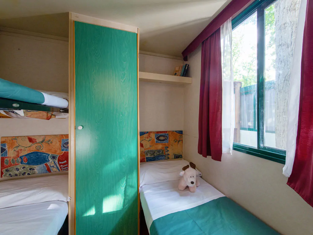 camping-village-punta-navaccia-mobile-home-interior-bedroom-single-beds-view