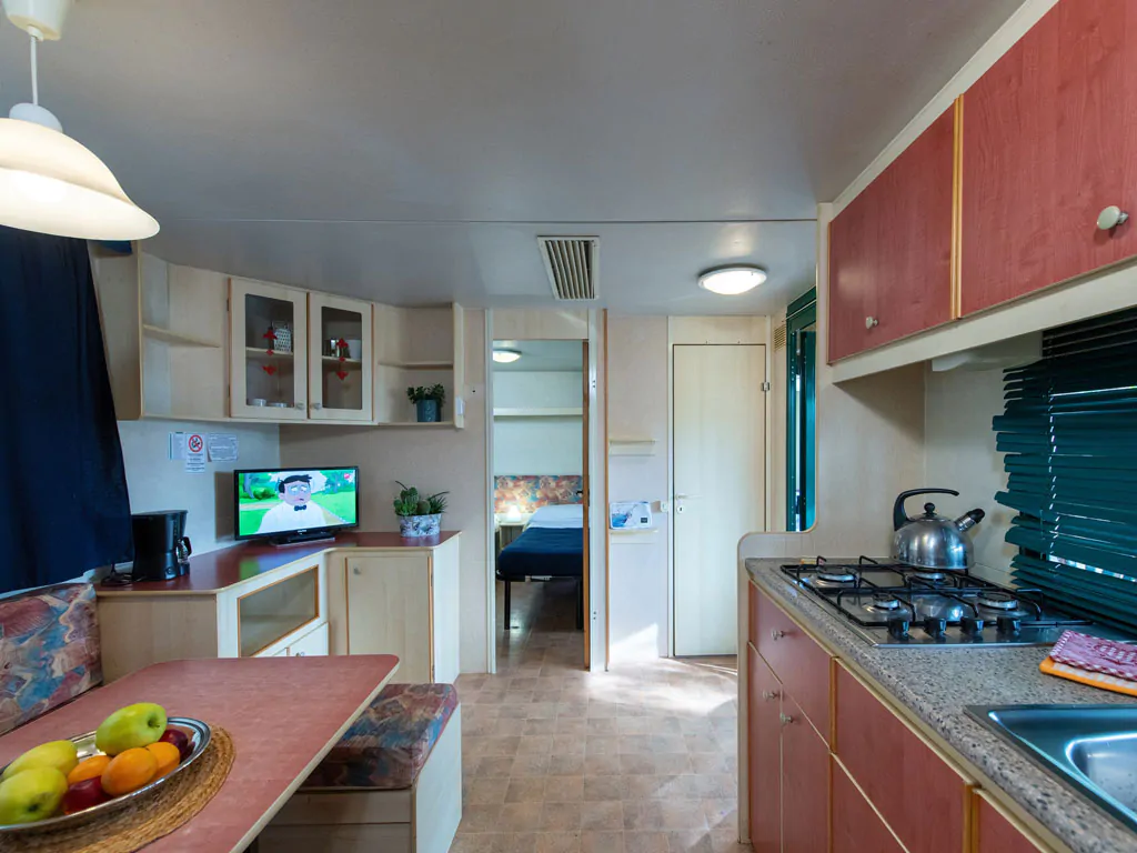 camping-village-punta-navaccia-mobile-home-interior-kitchen-and-living-room