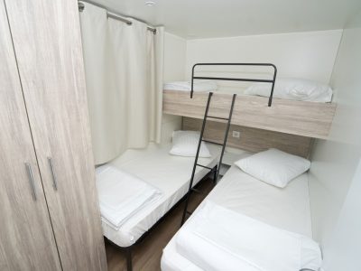 campsite-kovacine-mobile-home-family-plus-fkk-interior-bedroom-single-beds