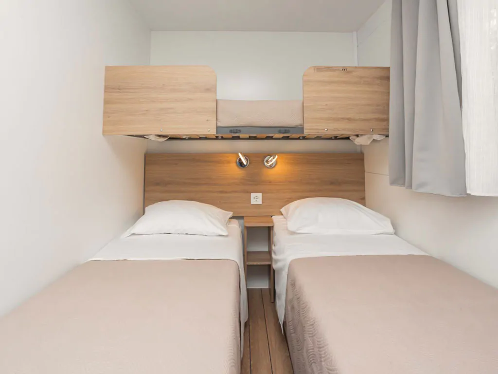 camping-resort-sibenik-mobile-home-a-first-row-interior-bedroom-single-beds-bunk-bed