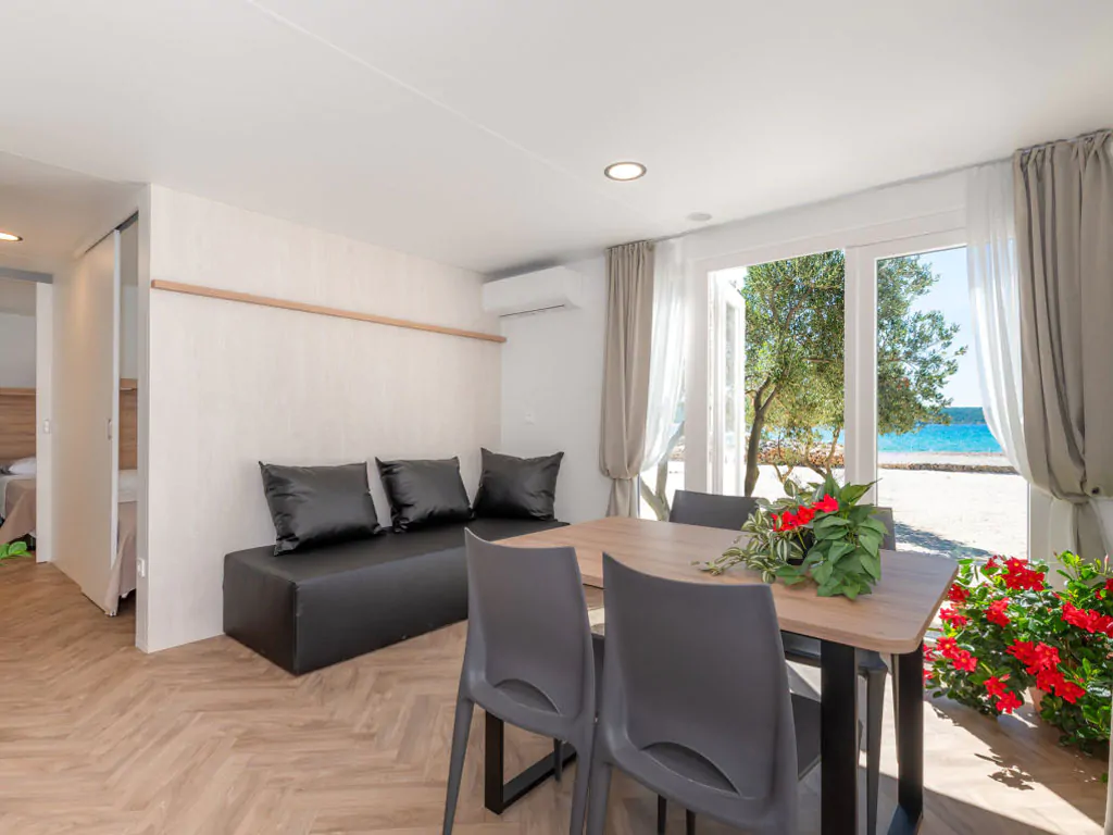 camping-resort-sibenik-mobile-home-s-first-row-interior-livingroom-table-sofa